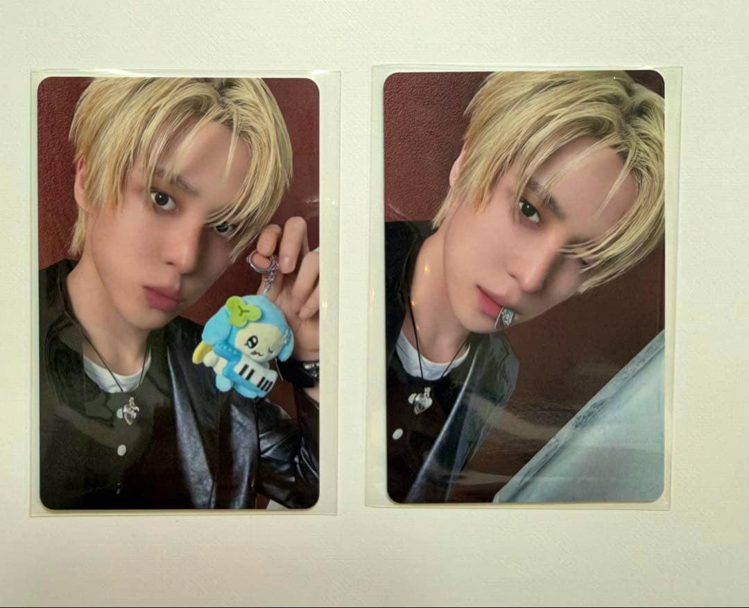 Two ATEEZ MIGHTEEZ Rockstar photocard fronts showing Yuno in protective sleeves, side by side.