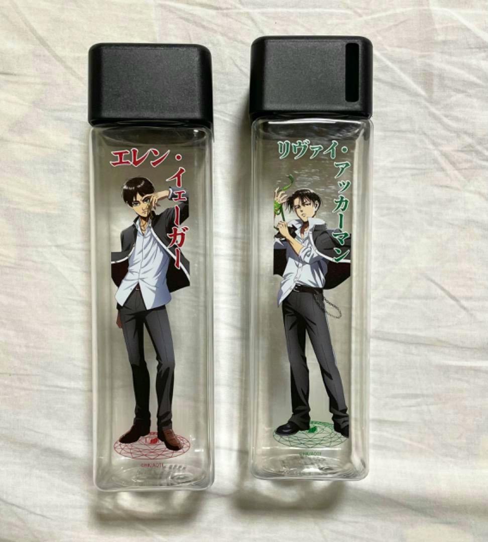 Two clear rectangular bottles with black caps featuring printed illustrations and Japanese names of Eren (left) and Levi (right).