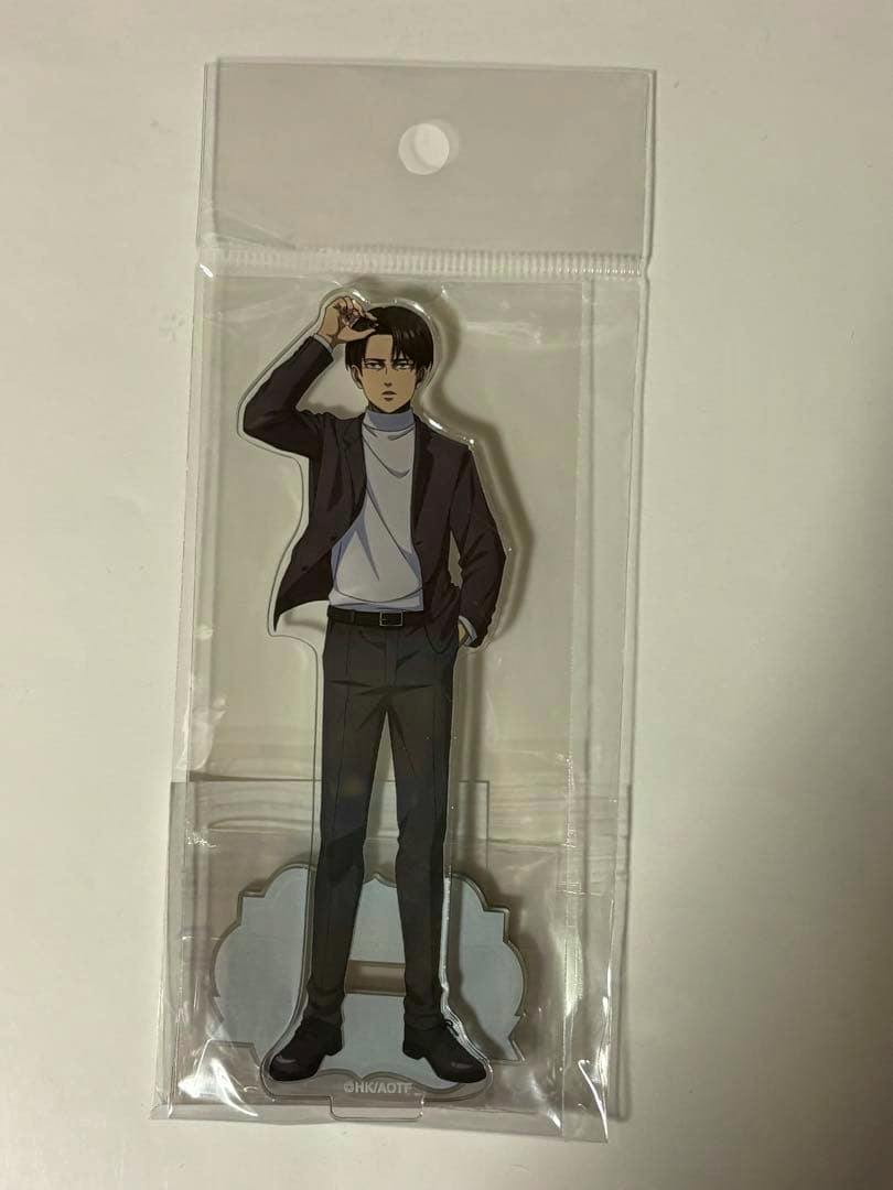 Front view of a Levi acrylic decorative stand in clear plastic packaging.