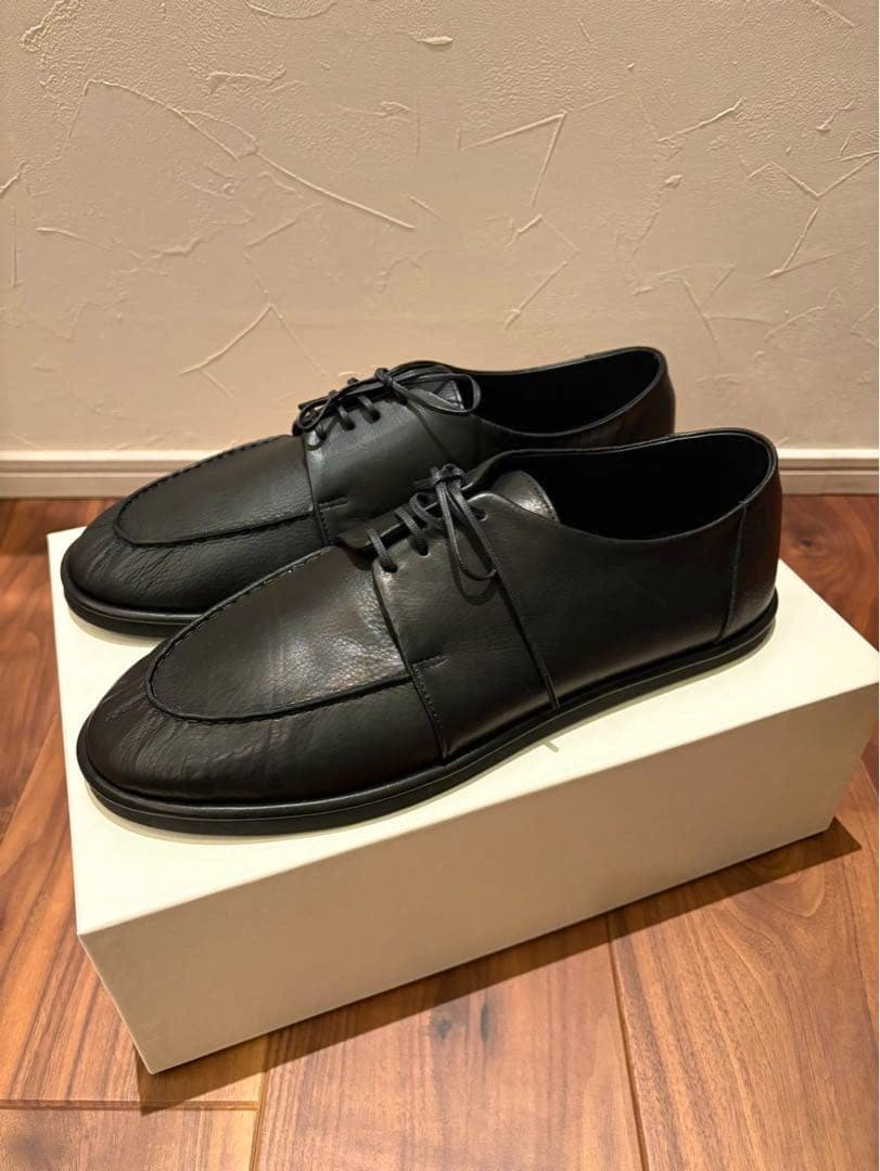 Pair of black AULAREE soft leather shoes (size 28.0) displayed on a white shoebox.