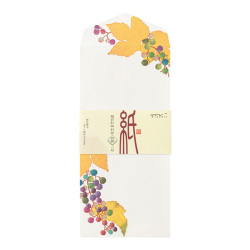 A white envelope showing autumn leaf and berry illustrations with a paper band label around its middle.