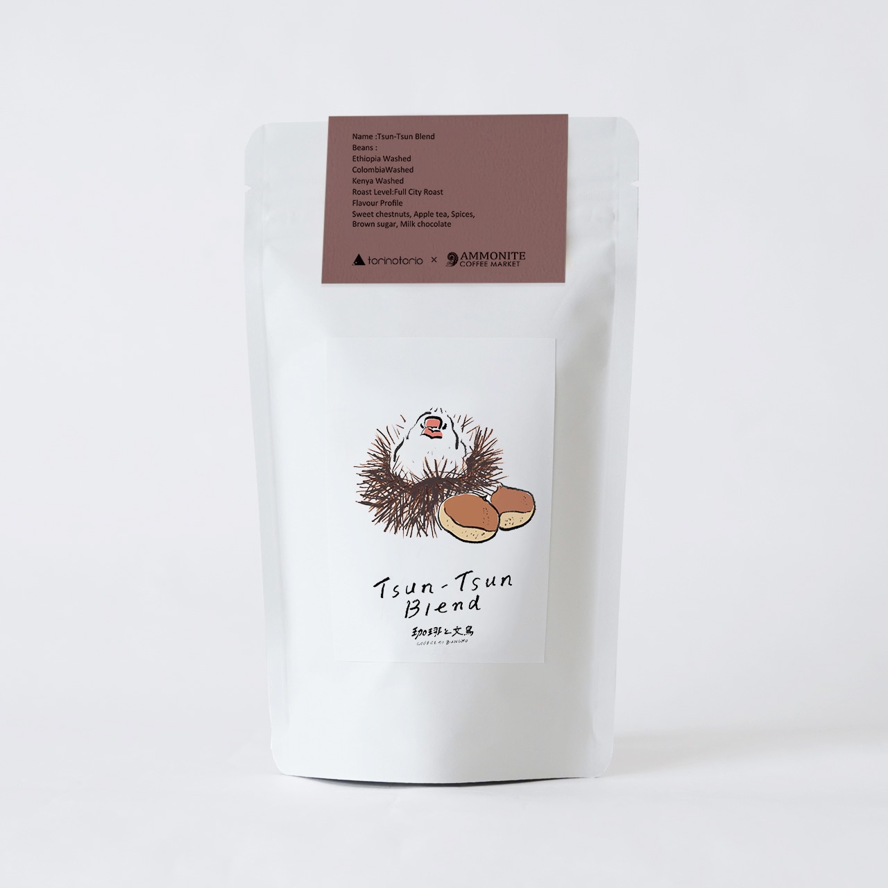 Sealed white pouch of roasted coffee beans labeled "Tsun-Tsun Blend" with a bird illustration.