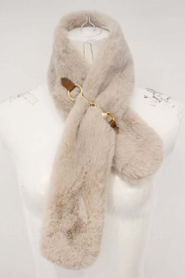 Beige polyester fur scarf with gold-tone bit detail shown on a white mannequin.