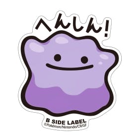 Full view of a purple Pokémon paper sticker shaped like Ditto with a simple smiling face, Japanese text above, and "B SIDE LABEL" printed at the bottom.