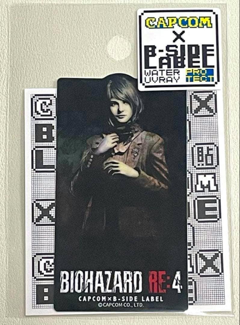 Photo sticker of Ashley from Biohazard RE:4 on a backing card with BIOHAZARD RE:4 text and B-SIDE LABEL/Capcom branding.