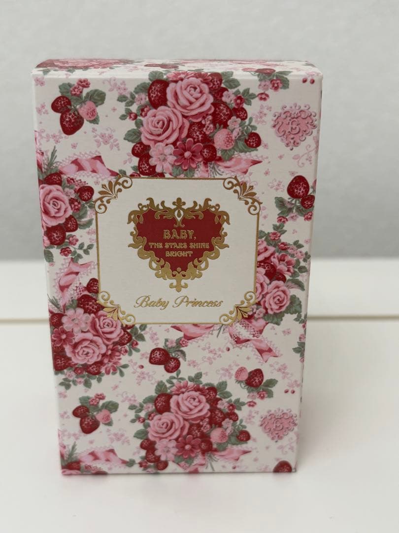 Front of the Baby Princess ベイビープリンセス オードトワレ perfume box decorated with pink roses and a gold ornamental label.