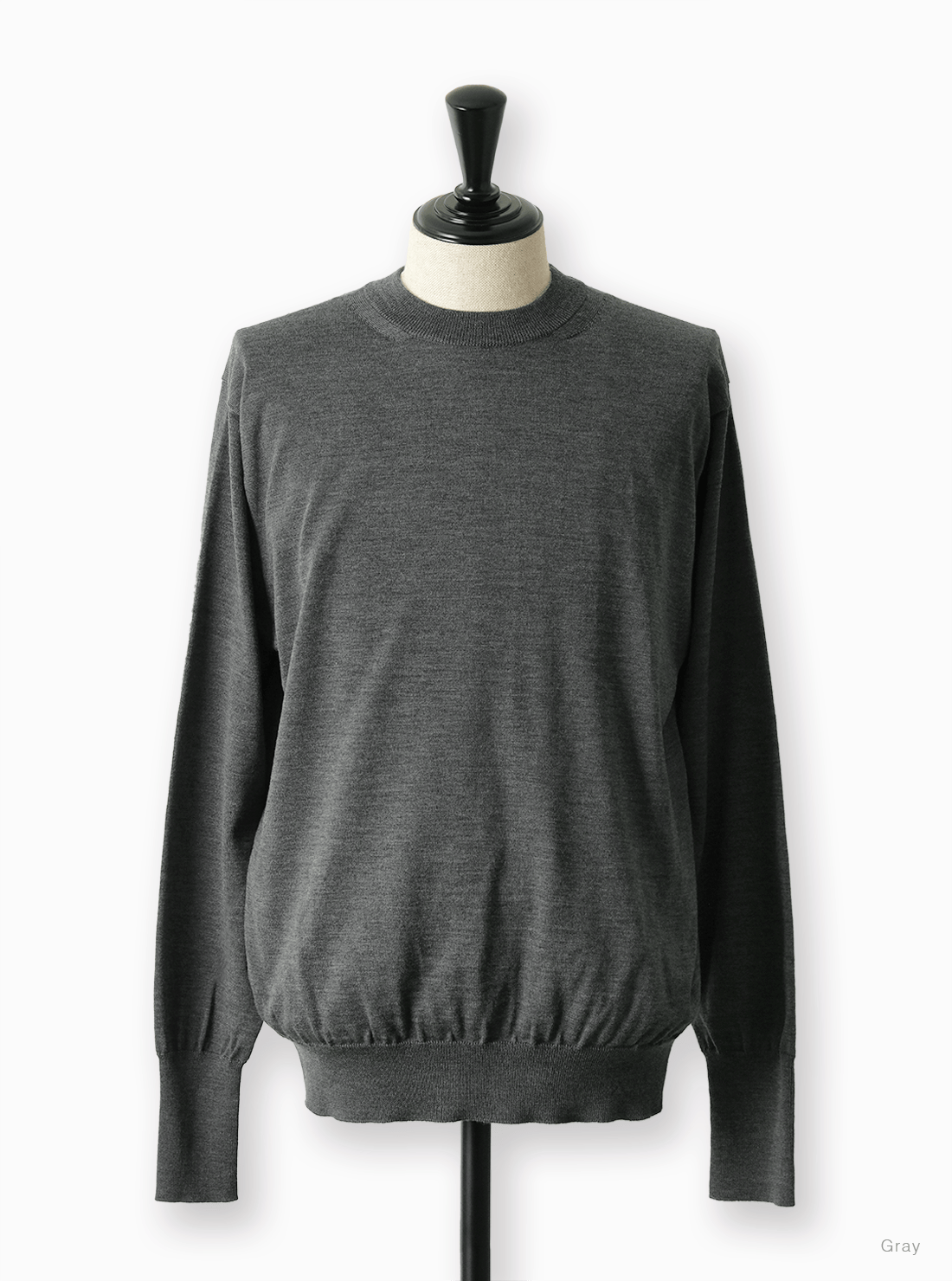 Front view of the baby wool crew neck sweater displayed on a mannequin.