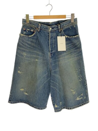Front view of baggy indigo denim men's shorts with a tag attached, hanging on a hanger.