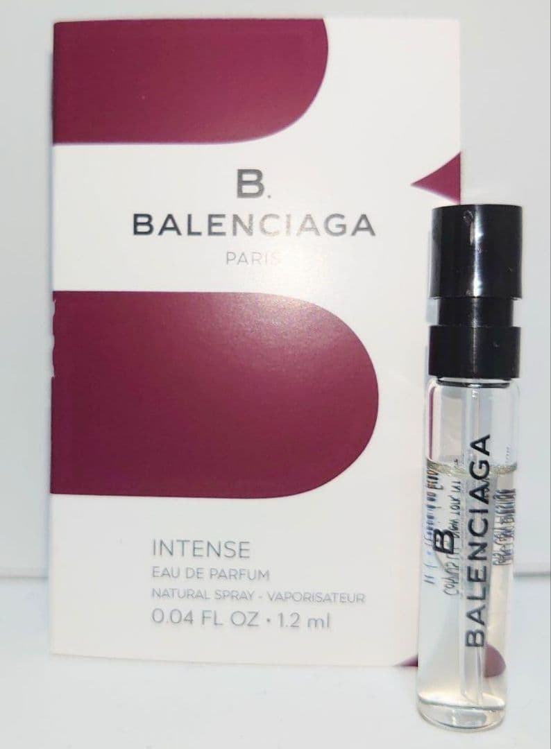 A small Balenciaga B Intense eau de parfum sample vial standing next to its branded card packaging.