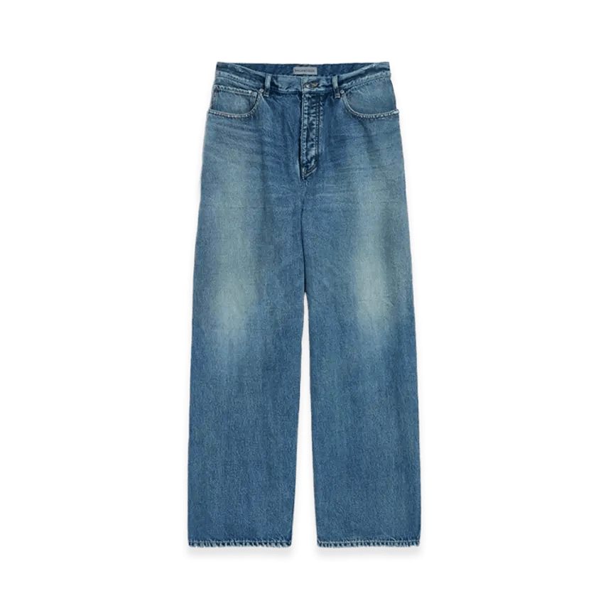 Front view of dark blue baggy men's denim jeans laid flat, showing waistband, front pockets, fly, and faded knee detailing.