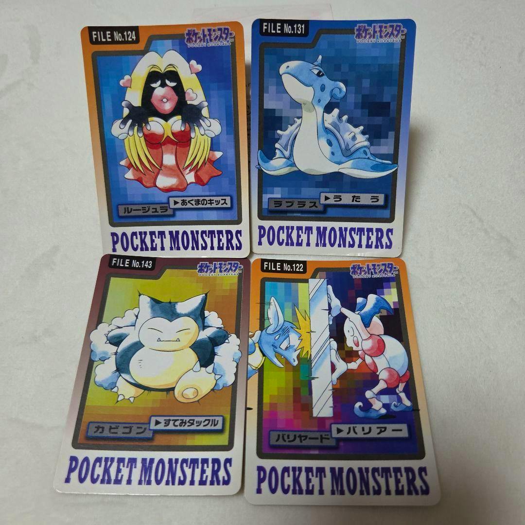 Four Bandai Pocket Monsters Carddass photocards laid out on a white surface showing Pokémon artwork including Jynx and Lapras.