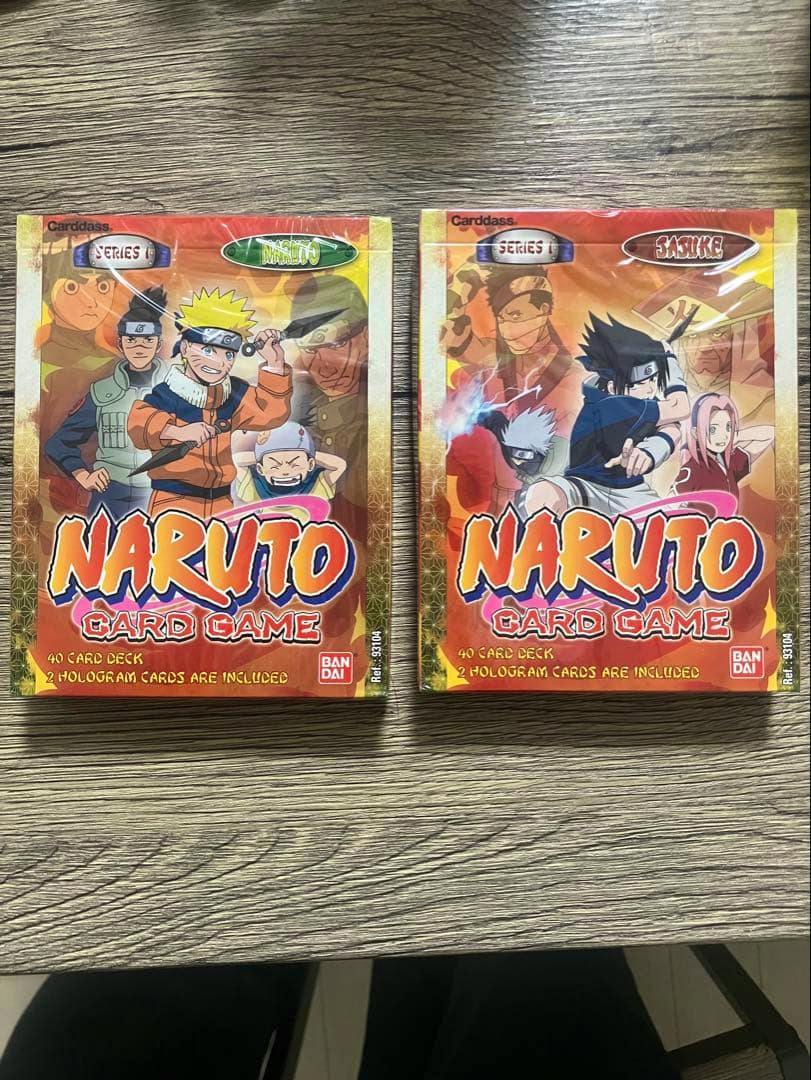 Two BANDAI Naruto card game starter deck boxes shown front-side on a wood surface.