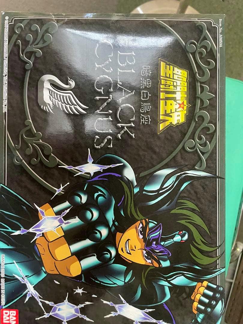 Photograph of the product box front showing illustrated Cygnus figure artwork and the 'Black Cygnus' title.