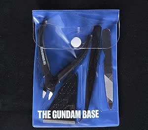 Photo of the Bandai Spirits Gundam Base limited plastic model tool set in a blue pouch containing nippers, tweezers, and a file.