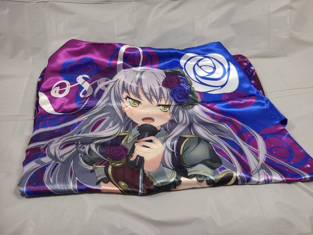 Folded polyester blanket printed with an illustration of Roselia's Yukina Minato holding a microphone on a white background.