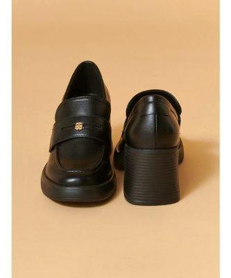 A pair of black synthetic leather heeled loafers shown from front and back on a beige background.