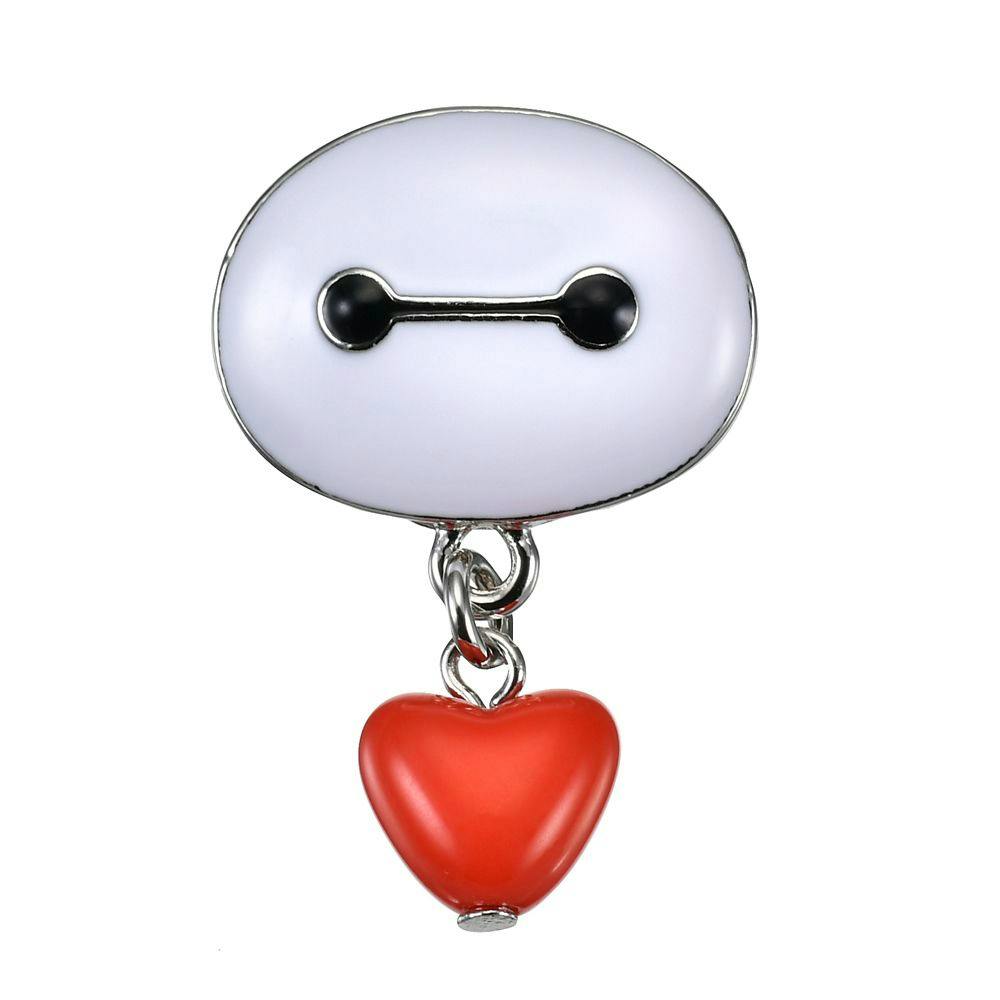 A front-facing Baymax face pin badge with a dangling red heart charm on a white background.