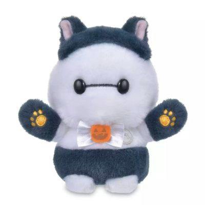 White Baymax plush wearing a dark gray cat costume with paw-printed mittens and a small bow on its chest.