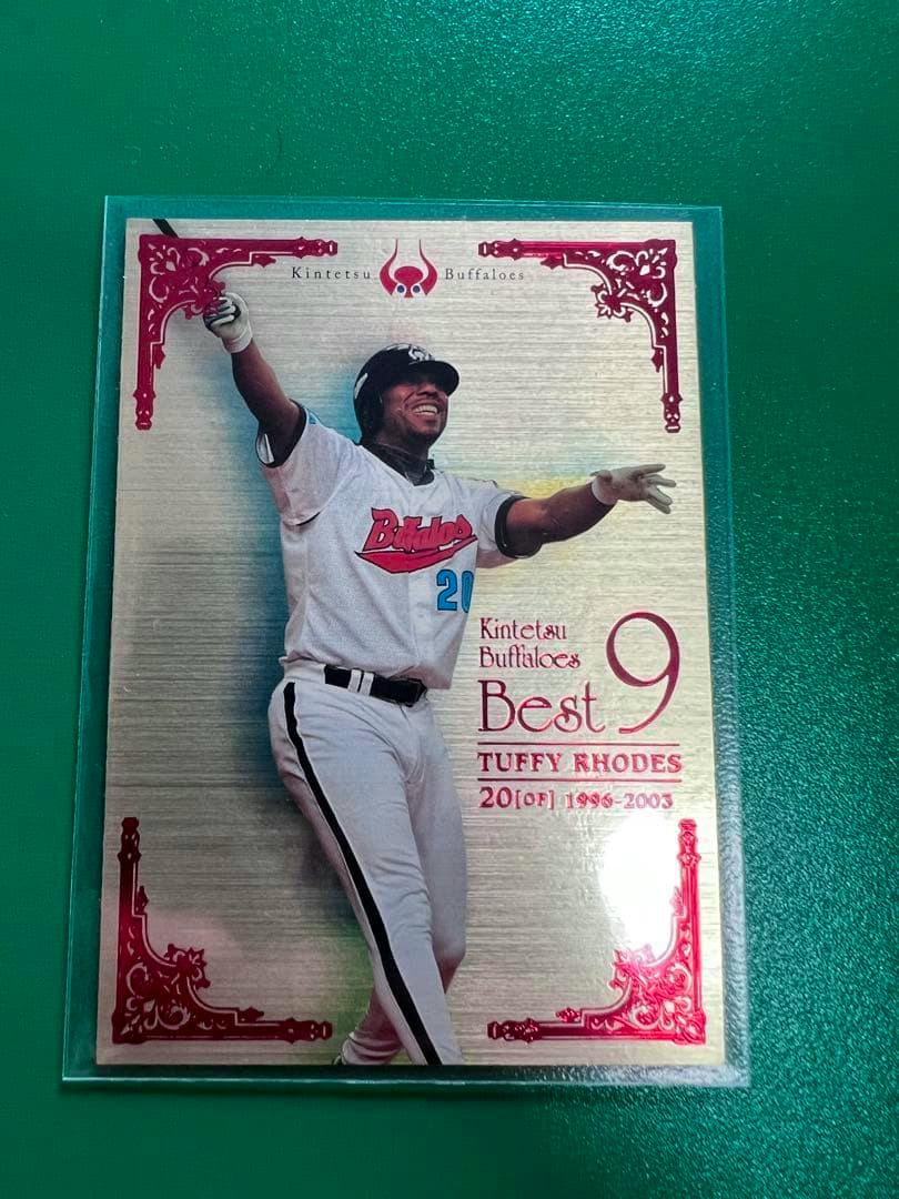 Front of a BBM 2009 Best9 photocard showing a baseball player in a Kintetsu Buffaloes uniform with decorative red corner accents.