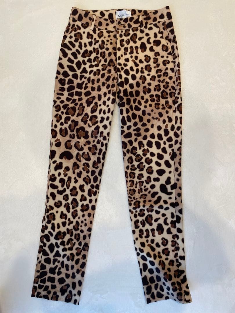 Front view of be blumarine women's leopard-print pants laid flat on a white background.