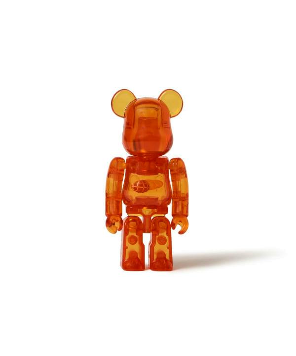 Orange translucent BE@RBRICK × BEAMS 50th 100% plastic figure shown front-facing on a white background.