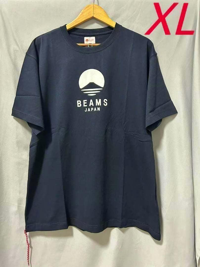Front view of a navy BEAMS JAPAN short-sleeve T-shirt with a white logo, hung on a wooden hanger.