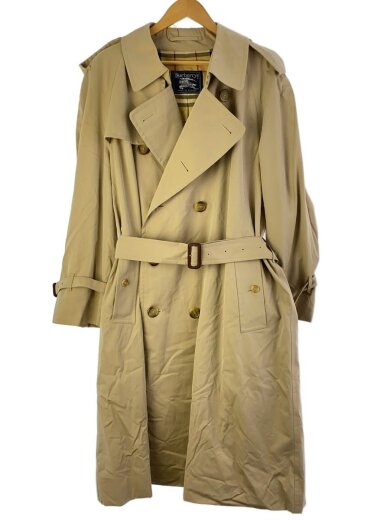 Front view of a beige cotton women's trench coat hanging on a hanger.