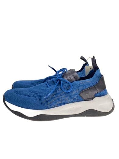 Side view of BERLUTI blue low-cut sneaker (synthetic leather) showing white midsole and black heel accents.