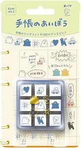 Blister-packaged set of nine small stamps displayed in a plastic tray on an illustrated backing card.