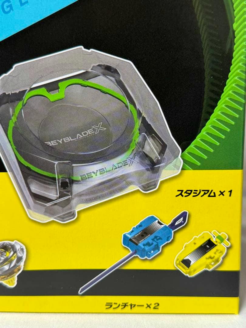 Close-up photo of the Beyblade X BX-53 box art showing the stadium and two launchers.