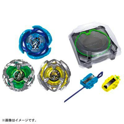 Photo of the BEYBLADE X BX-53 all-in-one set showing three spinning tops, a launcher with ripcord, a yellow accessory piece, and a round battle stadium.