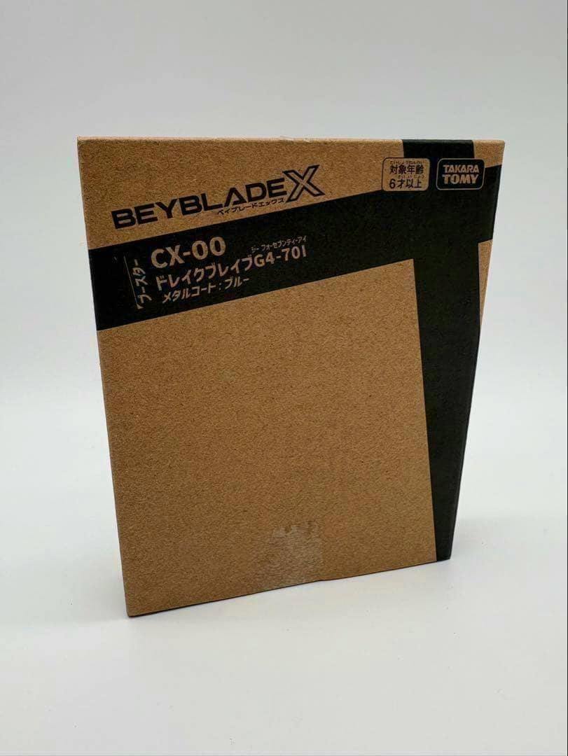 Front of the BEYBLADE X CX-00 booster box showing the product name and branding.