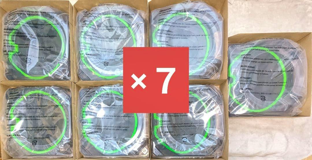 Seven plastic Beyblade X stadiums wrapped in plastic inside boxes with a red “×7” overlay.