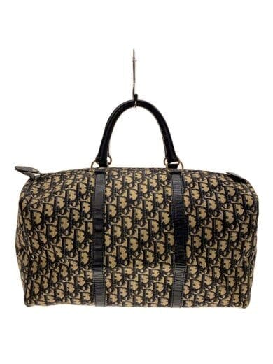 Front view of the black bag showing patterned fabric and two top handles.