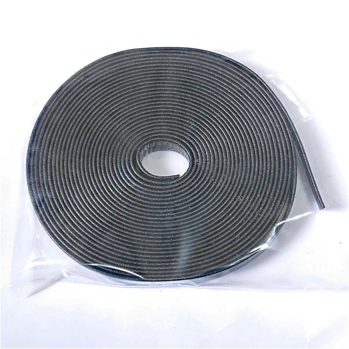 A coiled roll of black cow leather strip (belt material) shown on a white background.