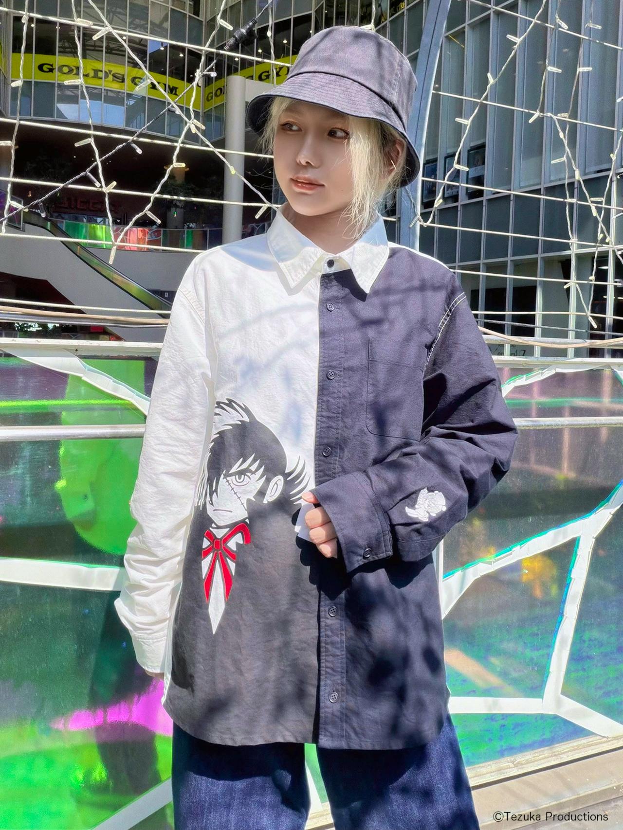 Model wearing the two-tone men's cotton Blackjack shirt, front view showing button closure and character print on the front.