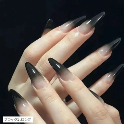Hands displaying long black ombre almond-shaped nail tips.