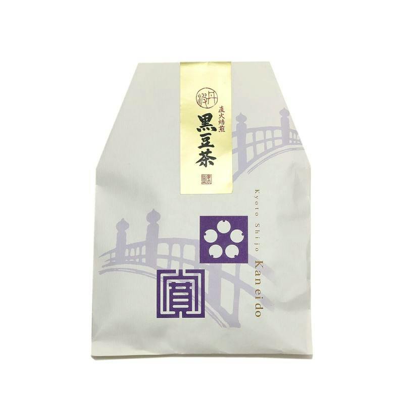 Flat bag package of 黒豆茶 (black tea) showing a purple bridge graphic and a gold vertical label.