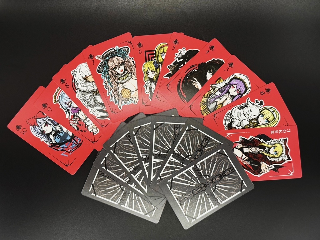A spread of BLACKSOULSトランプ Renewal playing cards showing red character faces and black patterned backs.