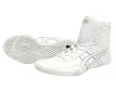 Pair of white polyester high-top shoes, one shown on its side revealing the sole.