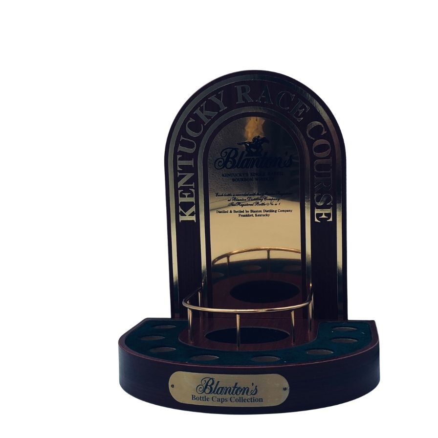 Wooden Blanton's bottle cap display stand with a mirrored back and circular cap slots.