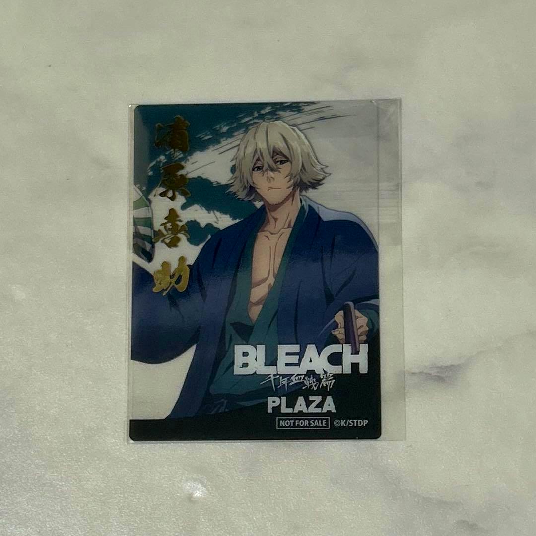 Clear plastic promotional card for BLEACH PLAZA depicting Urahara Kisuke in a blue robe, with "BLEACH", "PLAZA" and "NOT FOR SALE" printed at the bottom.