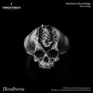 Front view of the Bloodborne × TORCH TORCH silver skull ring on a black background.