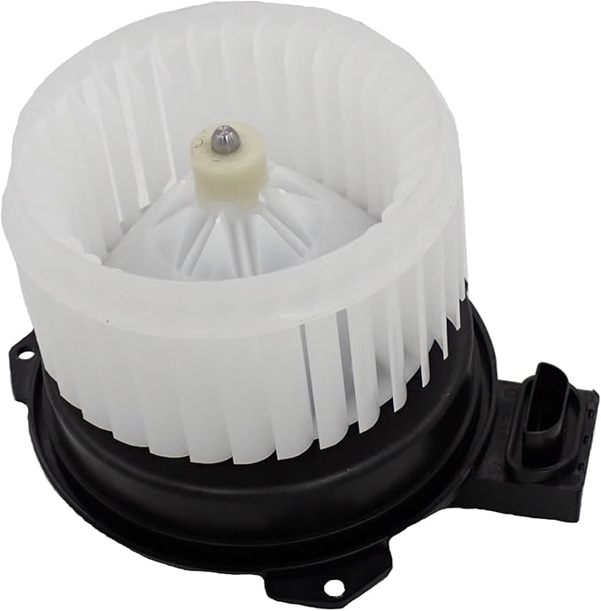 White plastic blower fan impeller with black motor housing for a vehicle.