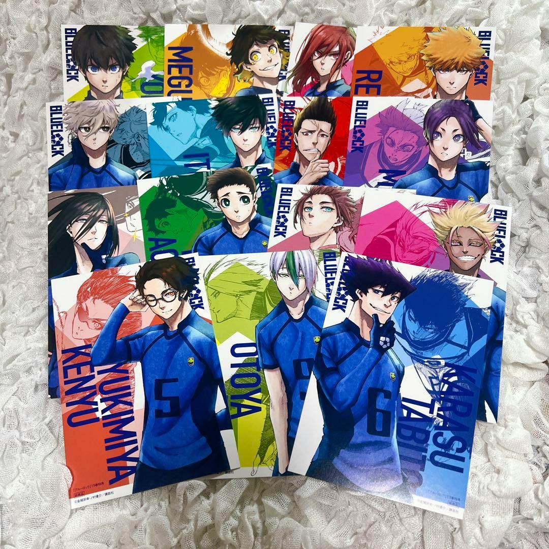 Several illustrated Blue Lock character postcards from the set arranged on a textured white surface.