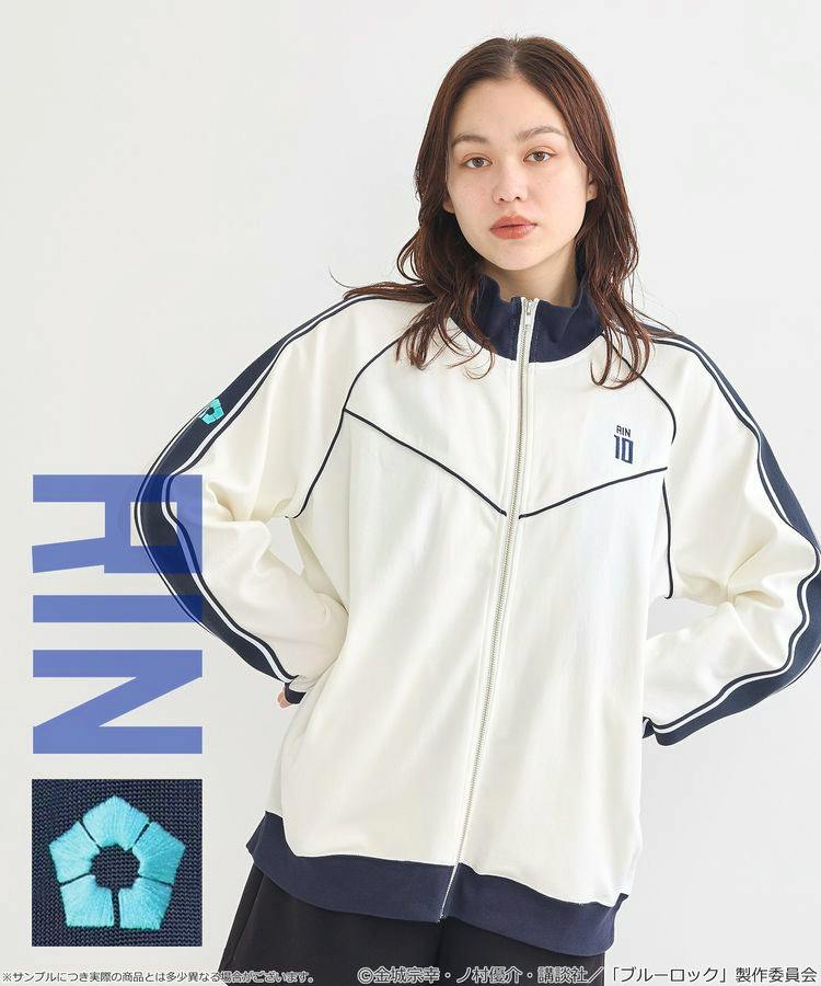 Model wearing a white and navy Blue Lock Itoishi Rin track jacket with front zipper and piping.