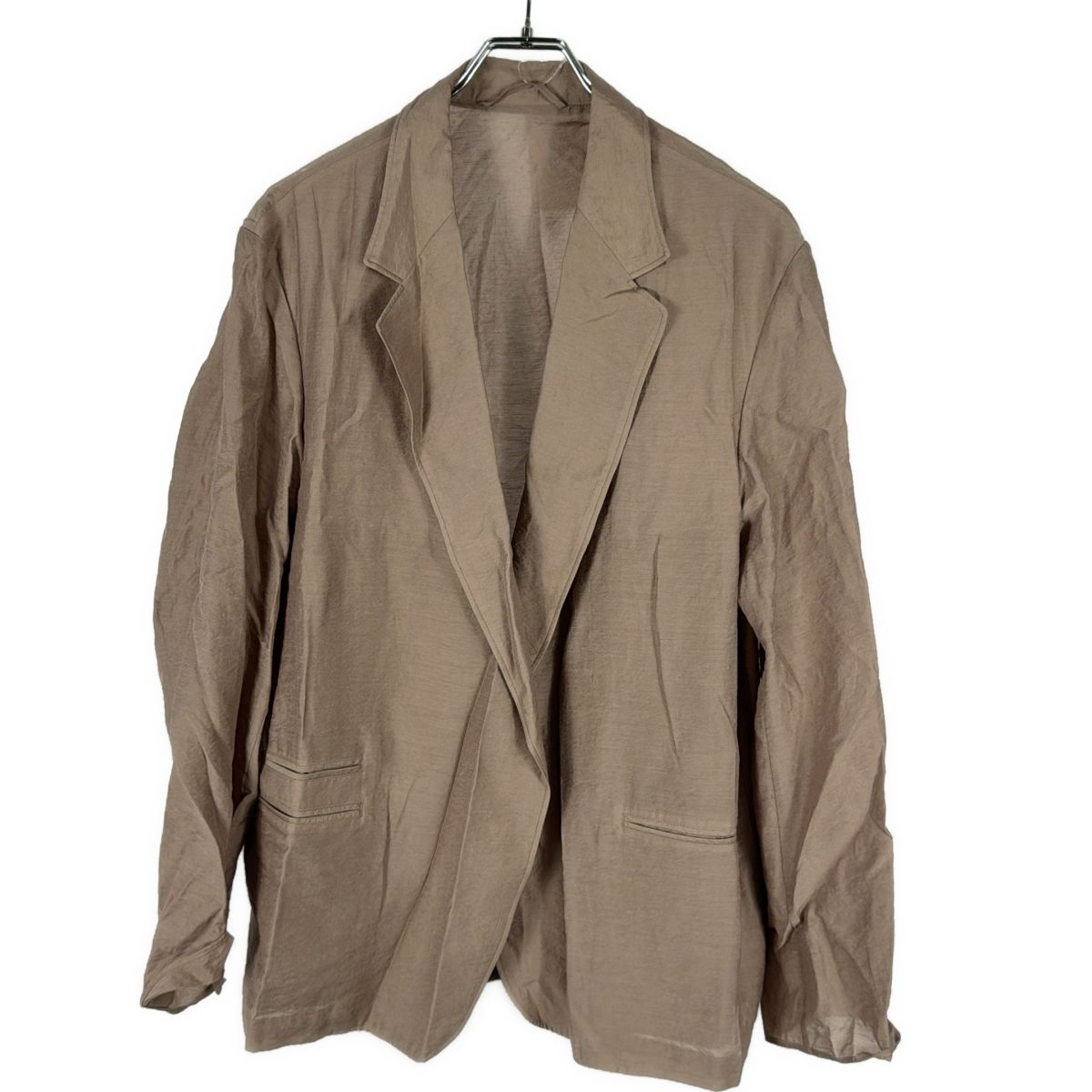 Beige women's cardigan-style jacket (rayon) hanging on a hanger against a white background.