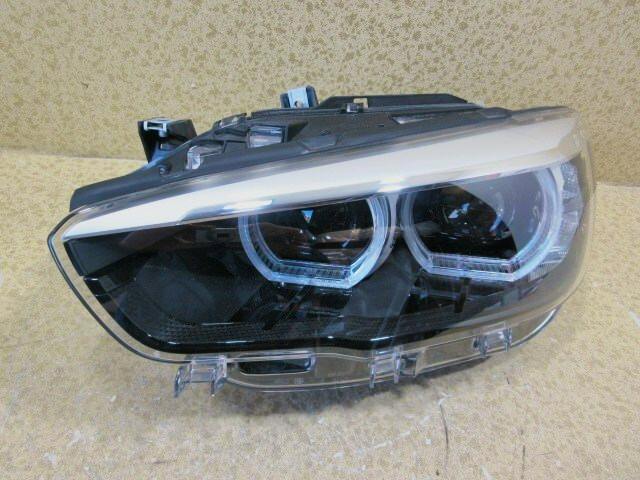 Front view of a BMW 1 Series F20 LCI left LED headlight assembly.
