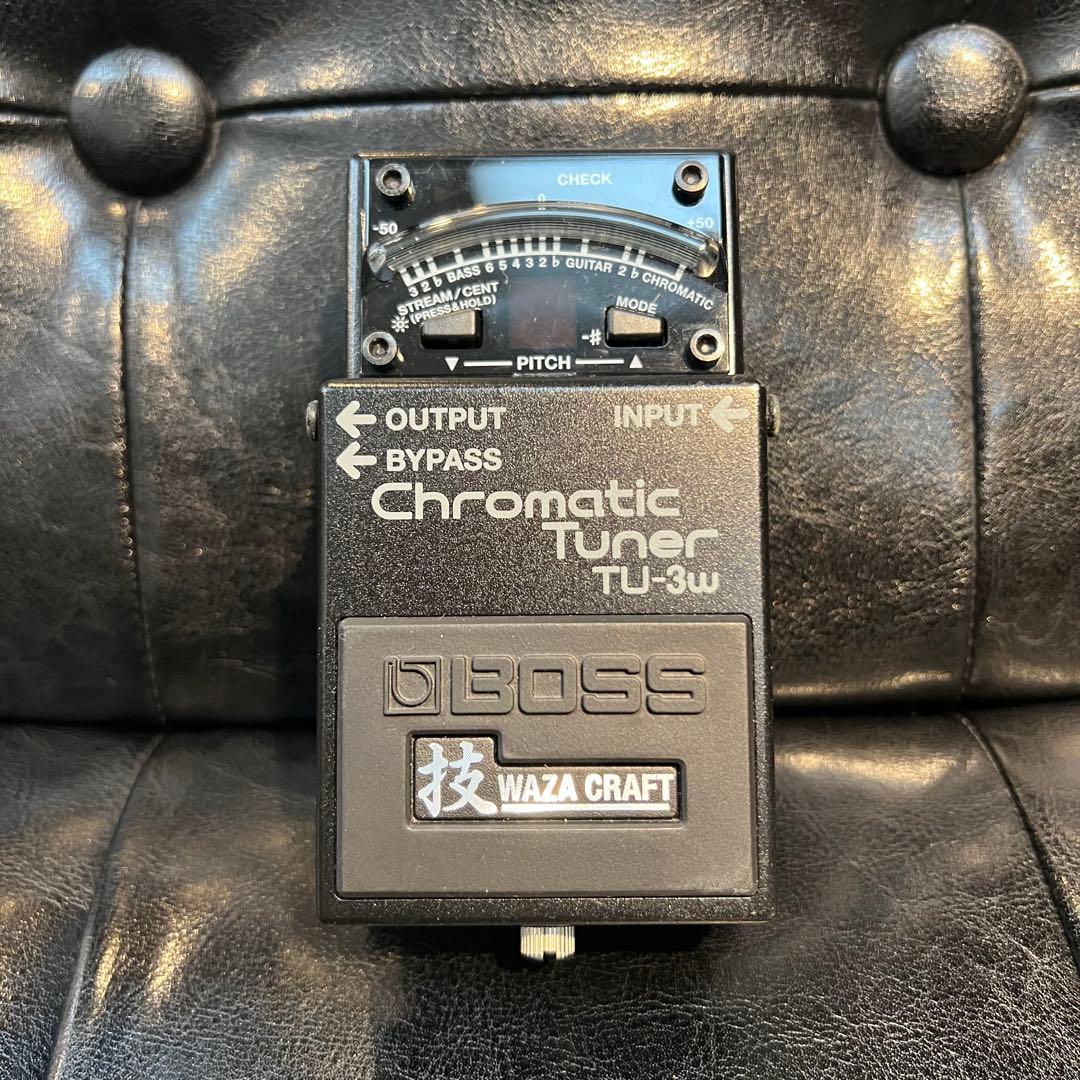 Front view of the BOSS Chromatic Tuner TU-3w pedal showing its display, labels, and Waza Craft badge.