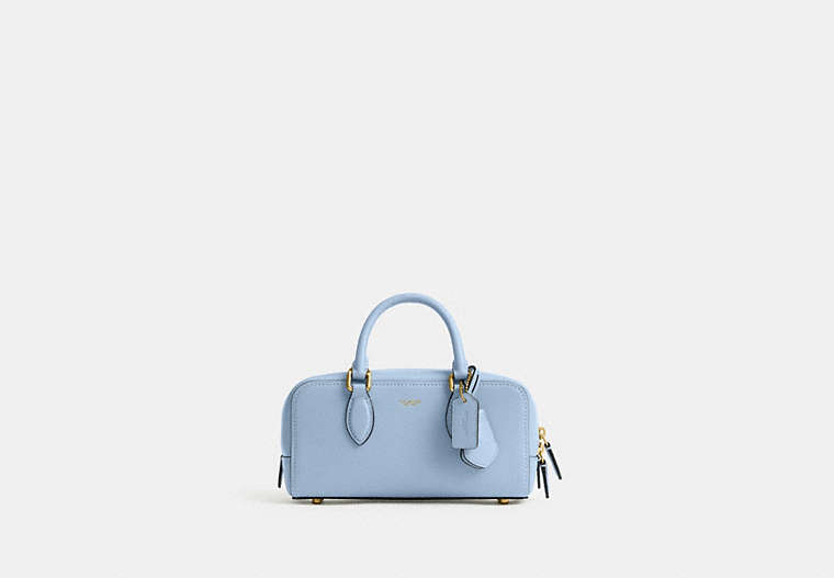 Front view of the バワリー サッチェル 22 satchel in light blue on a white background.
